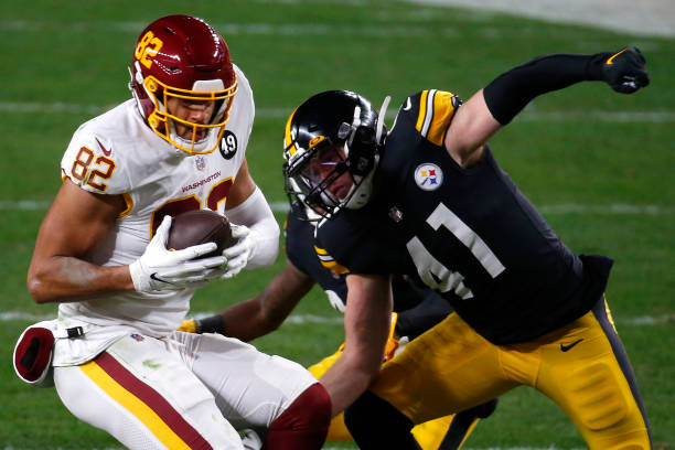 PITTSBURGH, PENNSYLVANIA - DECEMBER 07: Logan Thomas #82 of the Washington Football Team looks to gain yardage agaisnt Robert Spillane #41 of the Pittsburgh Steelers during the second quarter of their game at Heinz Field on December 07, 2020 in Pittsburgh, Pennsylvania. (Photo by Justin K. Aller/Getty Images)