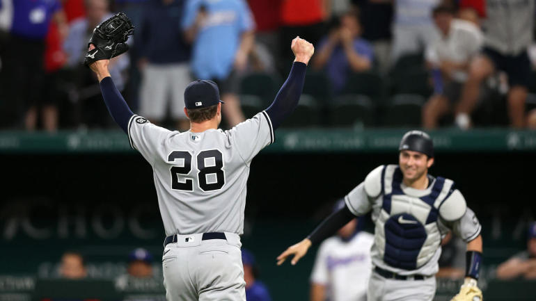 ARLINGTON, TEXAS - MAY 19:  Corey Kluber #28 of the New York Yankees celebrates a no-hitter with Kyle Higashioka #66 against the Texas Rangers at Globe Life Field on May 19, 2021 in Arlington, Texas. (Photo by Ronald Martinez/Getty Images)