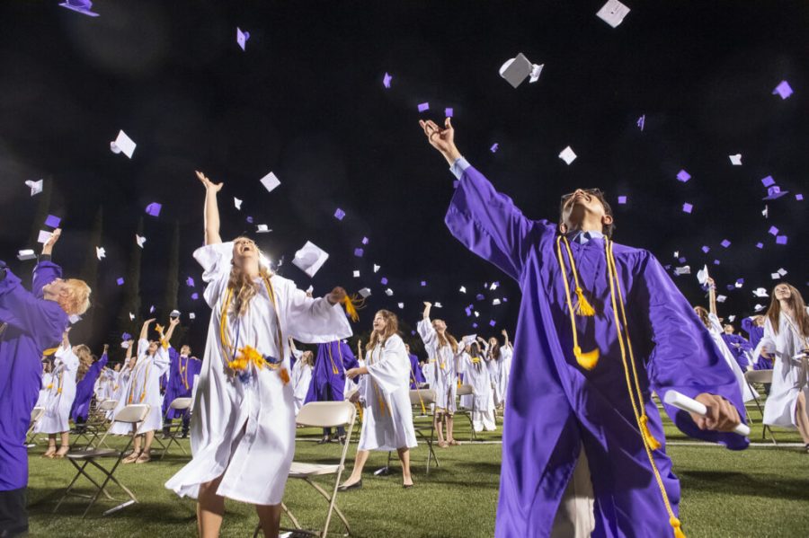 Shasta High School graduates fling their mortarboards into the air at the conclusion of the graduation ceremony at Shasta High School in Redding, Calif., Friday, Jun. 4, 2021.